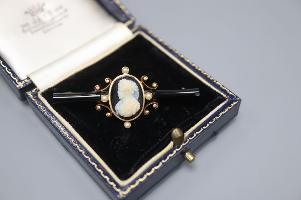 A Victorian gold, enamel and pearl bar brooch, set with a central cameo, 5.5cm